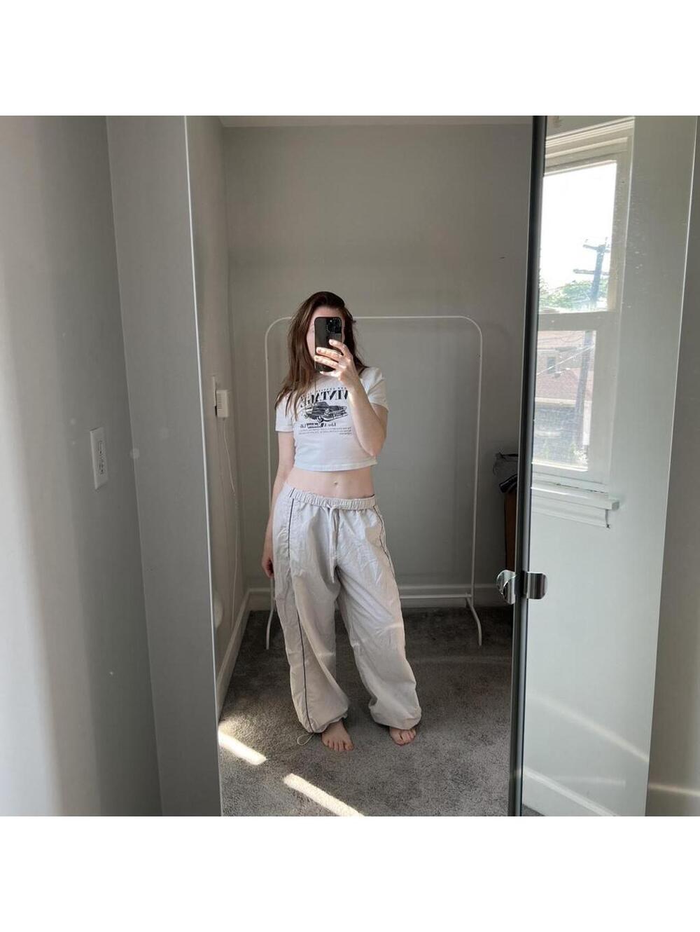 neutral streetwear vintage-inspired graphic baby tee Gilly Hicks parachute pants